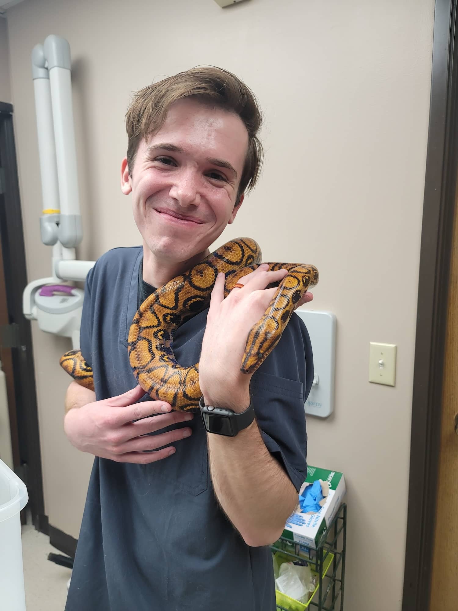Staff member holding snake